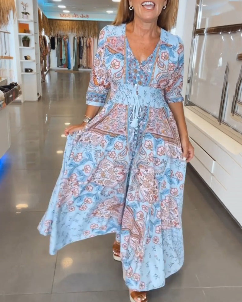 Vestido maxi bohemio de mujer con estampado floral y cintura ajustable, ideal para verano.