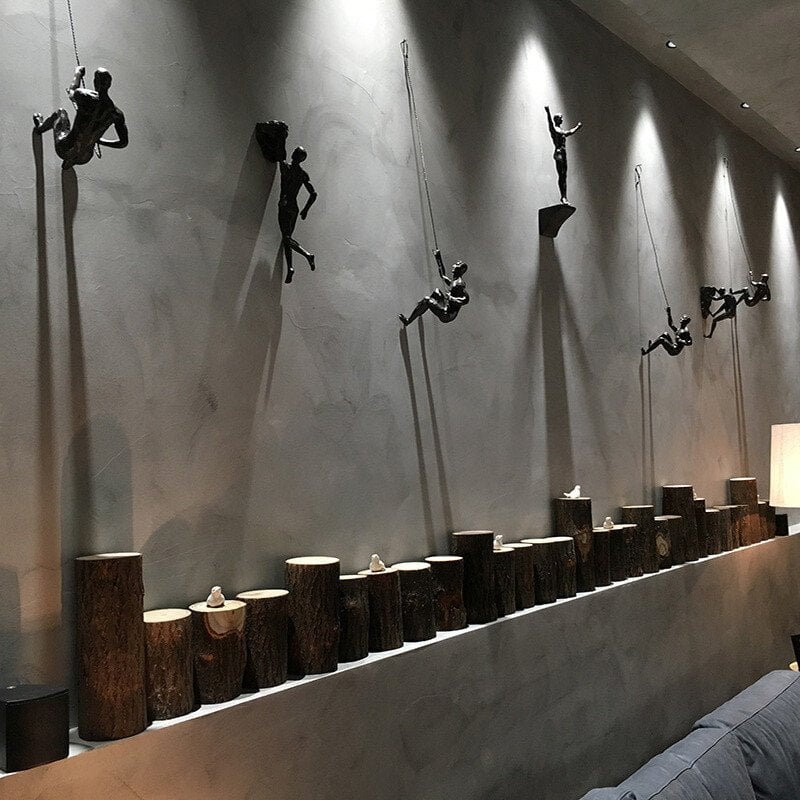 Arte mural 3D: escultura de escalador en resina, decoración hogar con diseño único.