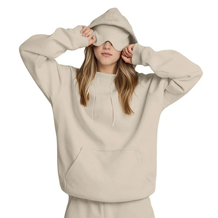 La sudadera de viaje definitiva para mujer, con capucha y máscara para total confort.