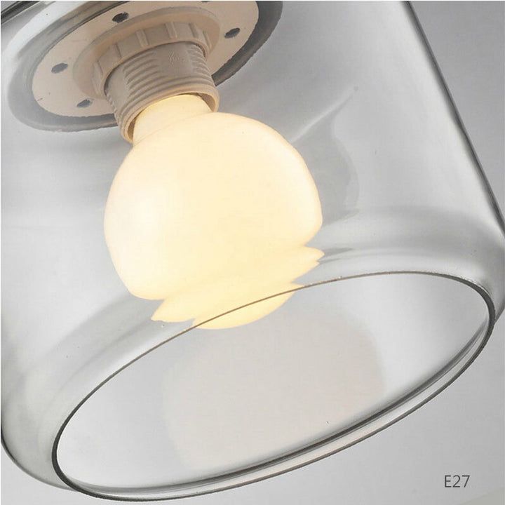 Iluminación elegante: lámpara colgante con pájaro y cilindro de vidrio. Ideal para decoración.