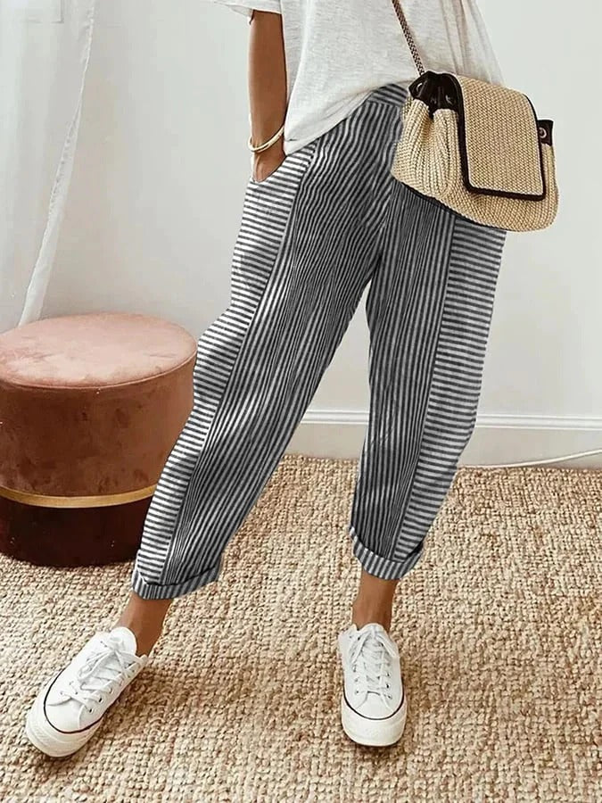 Pantalón fluido de lino a rayas para mujer. Diseño cómodo y transpirable ideal para verano, con cintura ajustable.