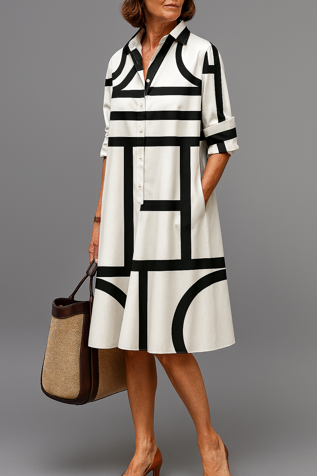 Vestido midi elegante para mujer, fluido y cómodo. Ideal para verano, estilo casual o formal en negro/blanco.