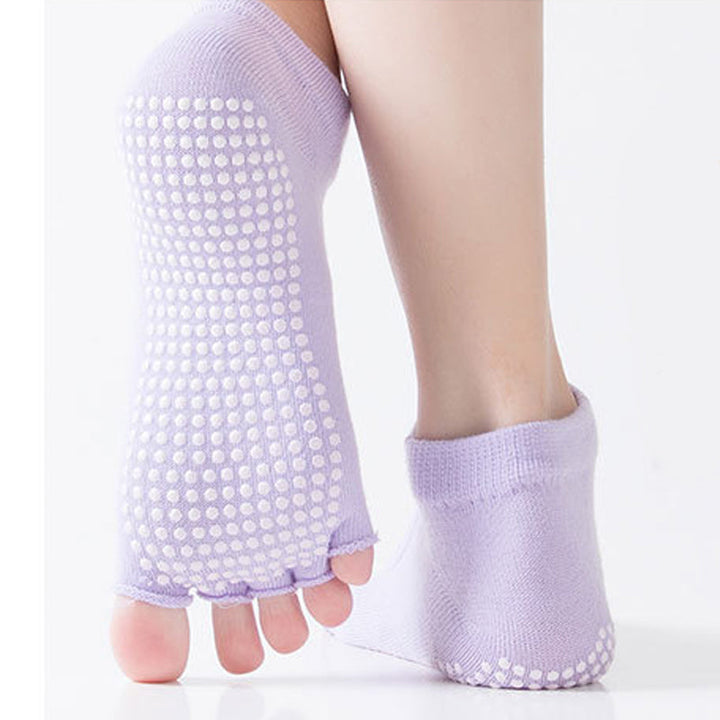 Par de calcetines antideslizantes de poliéster para yoga, mejora el agarre.