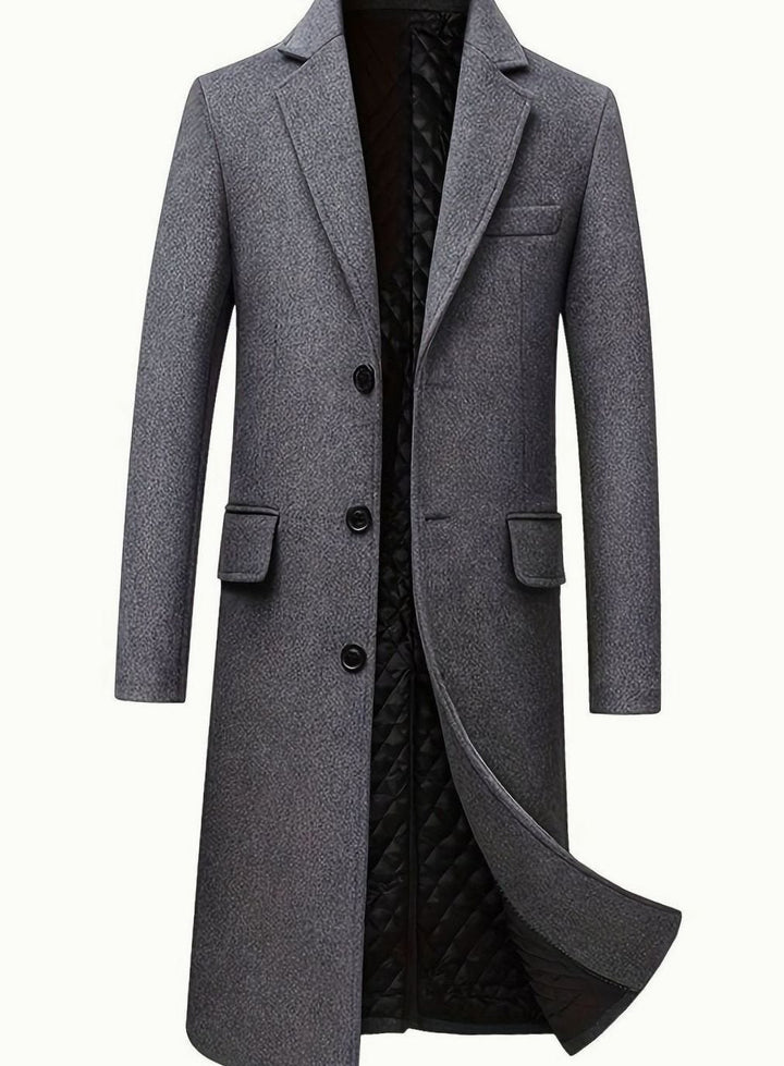 Abrigo de lana gris para hombre estilo sastre, largo y con botones. Perfecto para atuendos formales o de negocios en invierno.