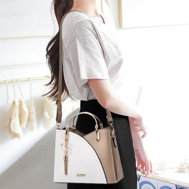 Elegante bolso de mano bicolor para mujer, de imitación cuero. Lujo y estilo para cualquier ocasión.