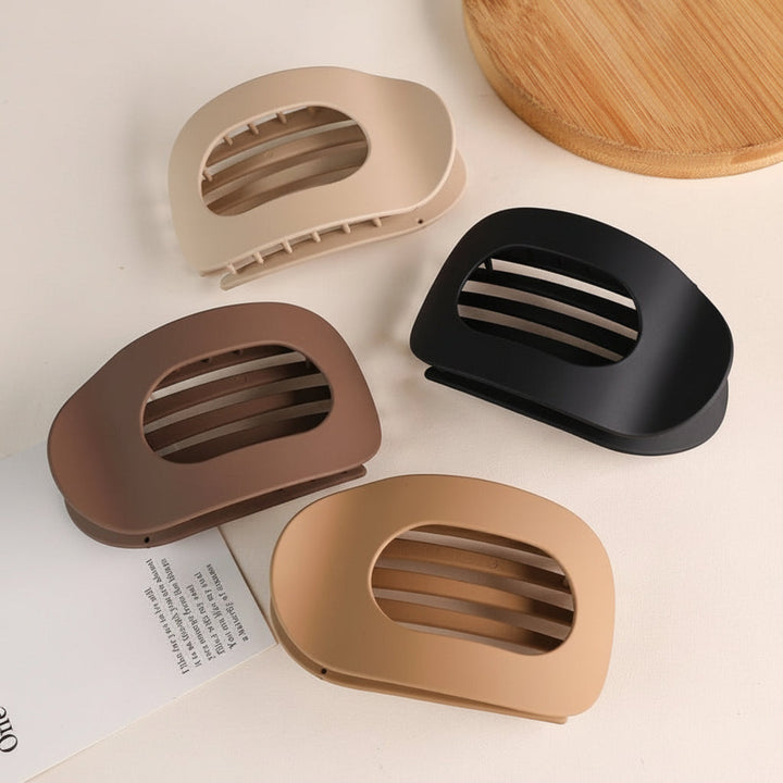 Pinza de pelo mujer, sujeción fuerte para cabello grueso. Accesorio elegante de plástico para peinados modernos.