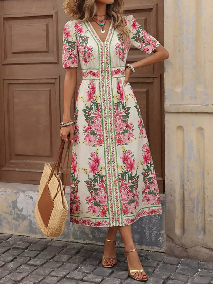 Vestido floral de mujer, corte midi y cuello en V. Comodidad y estilo vibrante para primavera.