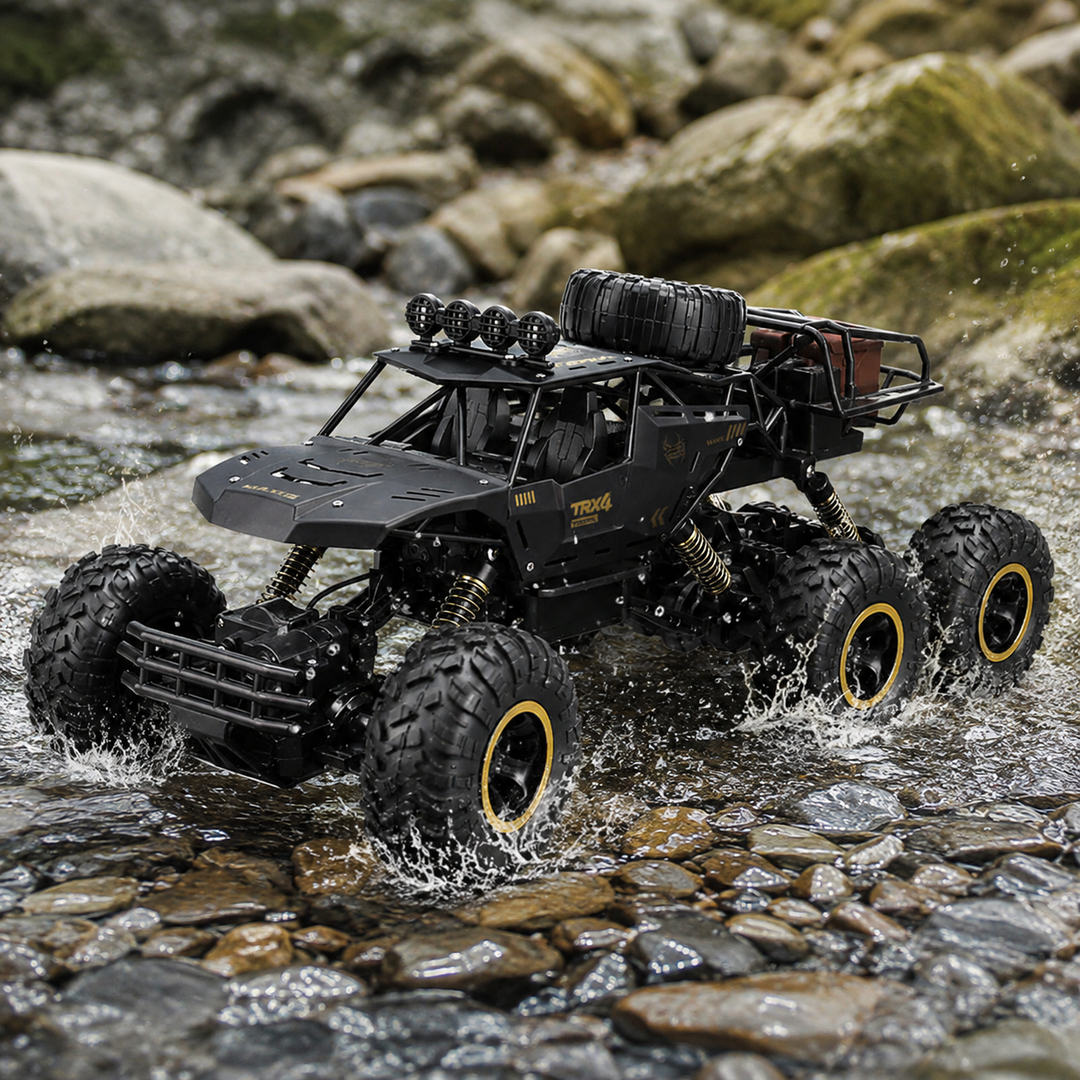 Vista frontal de un potente camión monster RC 1/12 de 6 ruedas para exploración todoterreno.