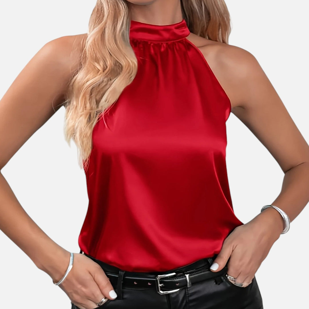 Blusa de mujer elegante con cuello halter, ideal para atuendos de verano o fiesta.
