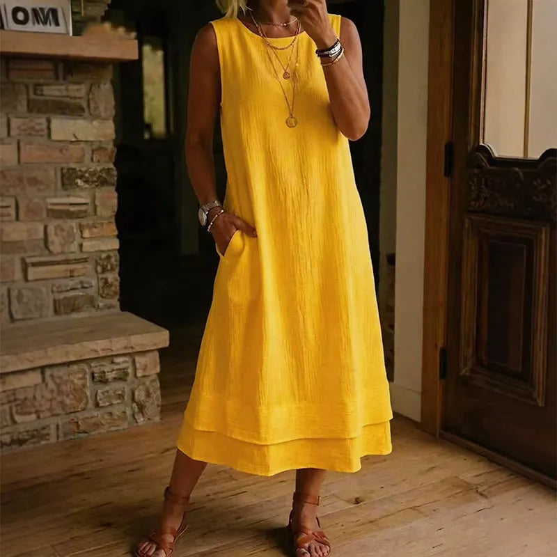 Vestido de mujer midi, sin mangas, con bolsillos y volante, ideal para estilo casual y vacaciones de verano.