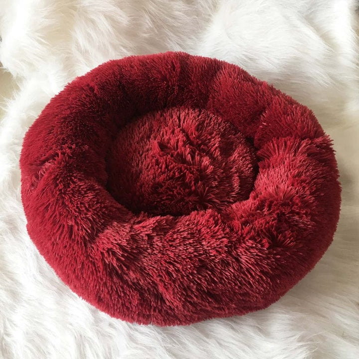 Confortable cama redonda para mascotas, con acolchado extra suave. Perfecta para siestas.