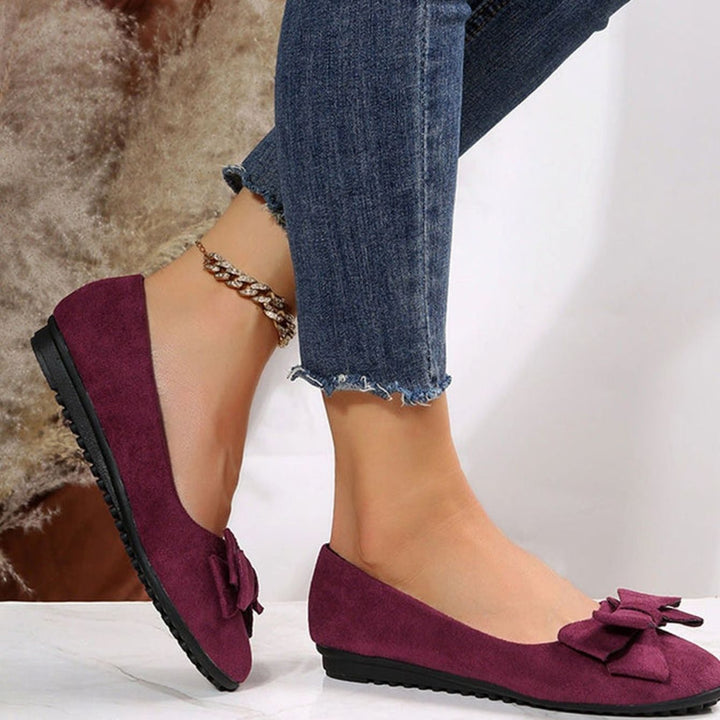Bailarinas planas Camille acolchadas para mujer, con lazo y diseño slip-on, ideales para confort casual.