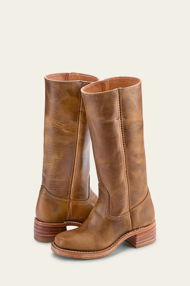 Botas elegantes de cuero flexible para mujer con tacón, estilo moderno y comodidad garantizada.