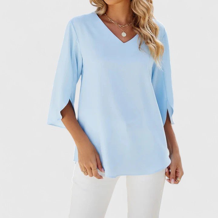 Blusa Carla elegante de mujer. Escote en V, volantes, manga media. Ideal primavera-verano y oficina.