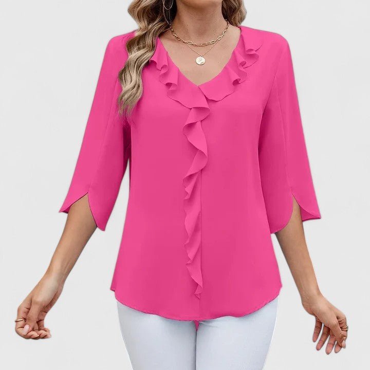 Blusa de mujer estilo versátil. Con escote en V y volantes, apta para oficina y ocasiones casuales.