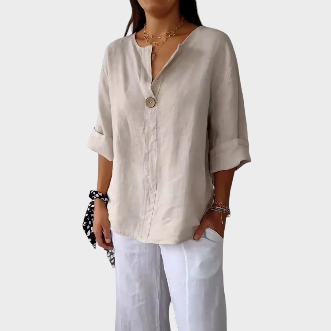 Blusa de lino elegante para mujer, con escote V. Ideal para looks casuales o más sofisticados de moda femenina.