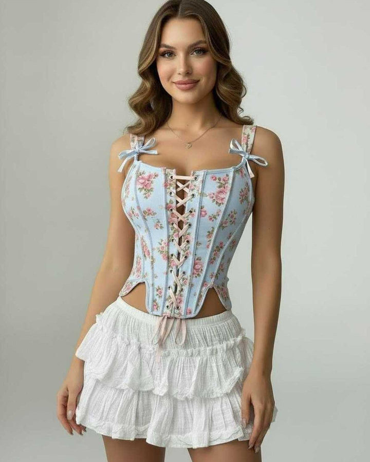 Top corsé celeste para mujer con delicado encaje floral. Estilo elegante y romántico.