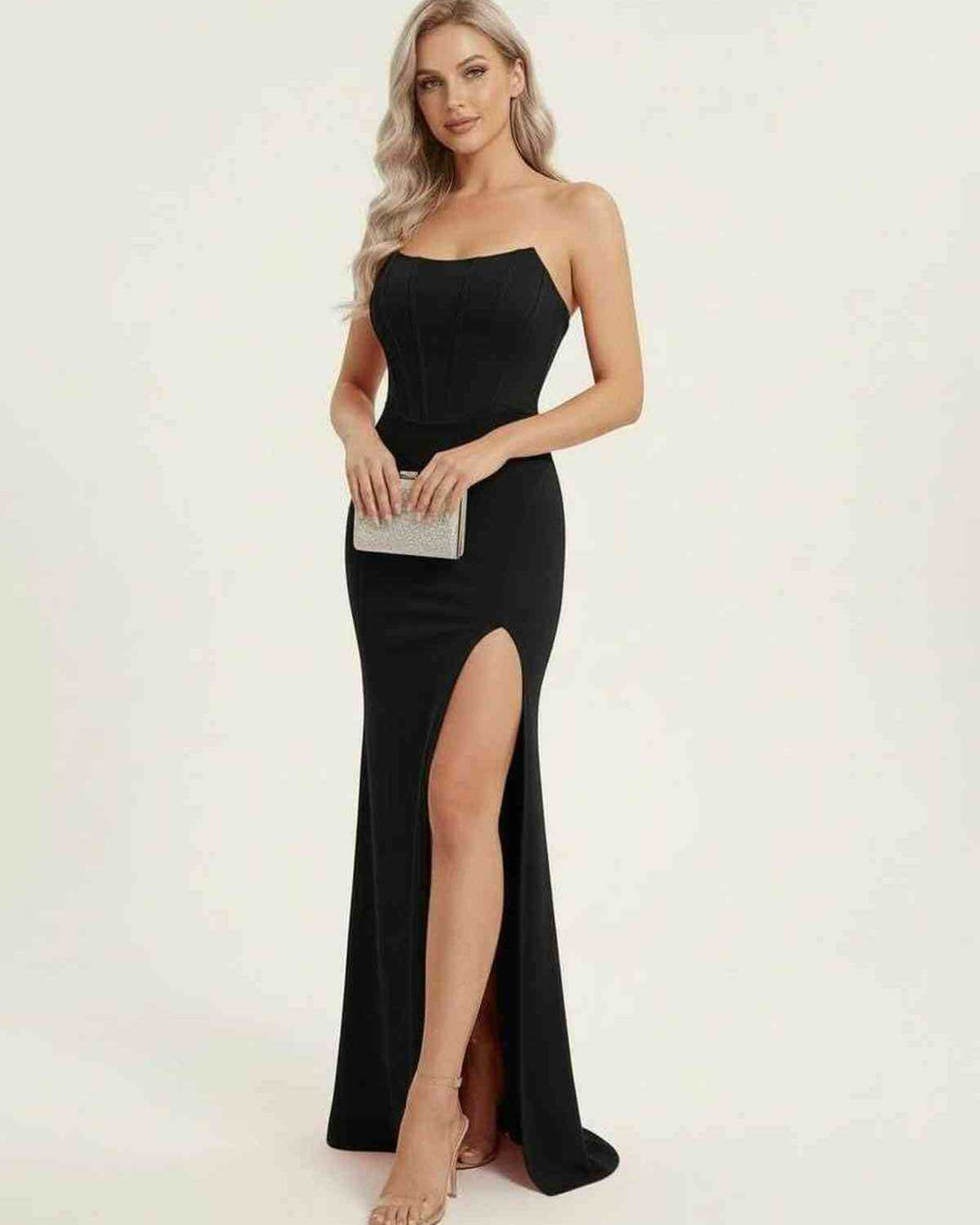Vestido de gala negro para mujer, largo, con corsé ajustado y abertura alta para un look sofisticado.