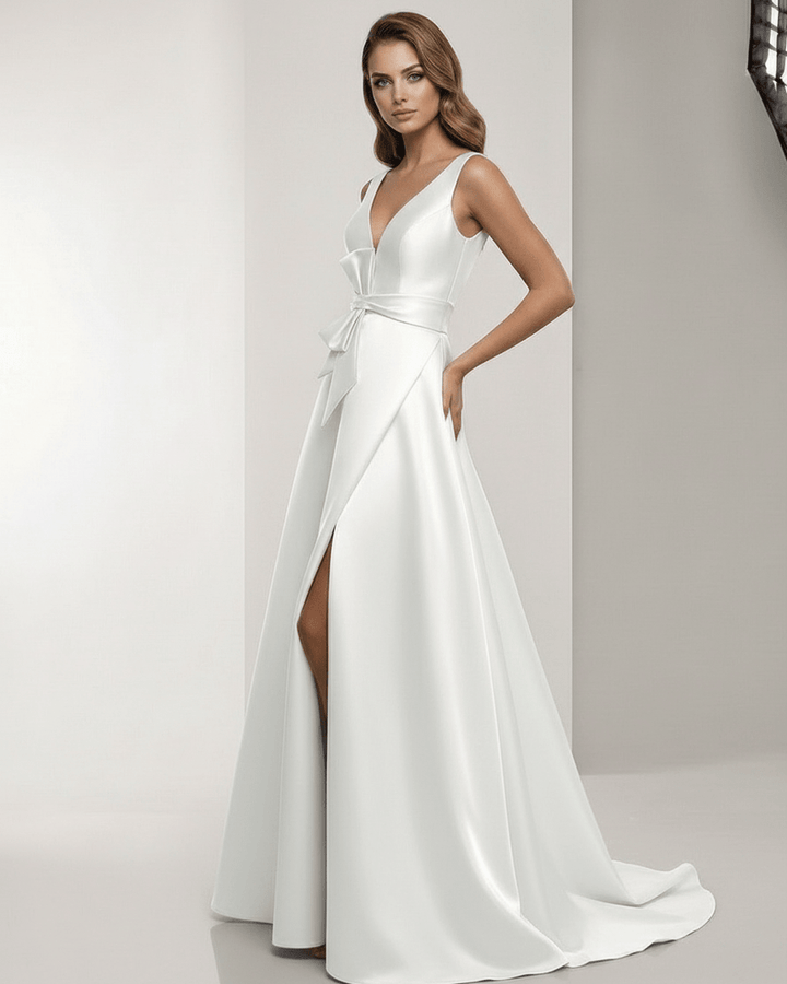 Vestido maxi blanco con escote V y lazo, ideal para cenas de gala y celebraciones especiales.