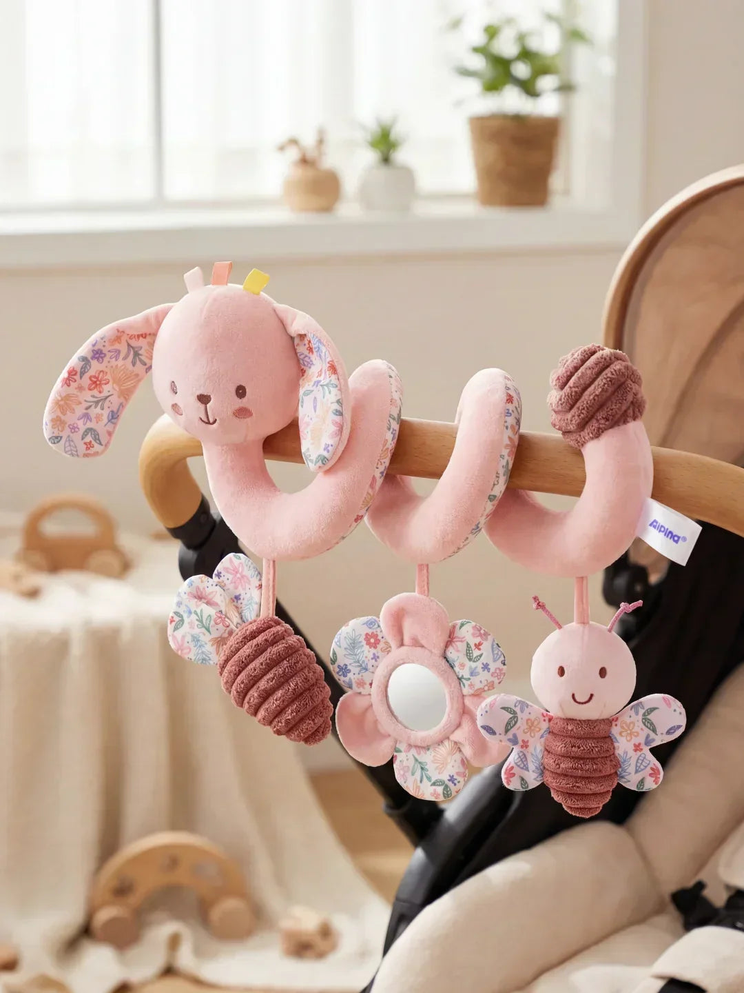 Espiral sensorial para cuna de bebé con mordedor, espejo seguro y muñecos de elefante y conejo.
