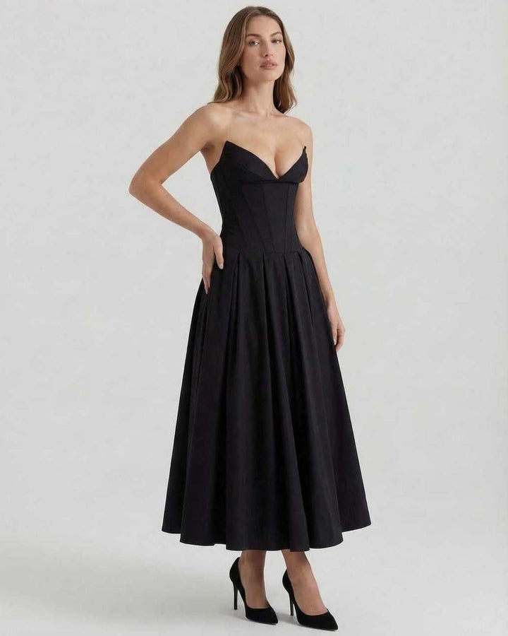 Vestido Cleo midi negro, sin tirantes y corte línea A, un estilo de moda femenina ideal para eventos y celebraciones.