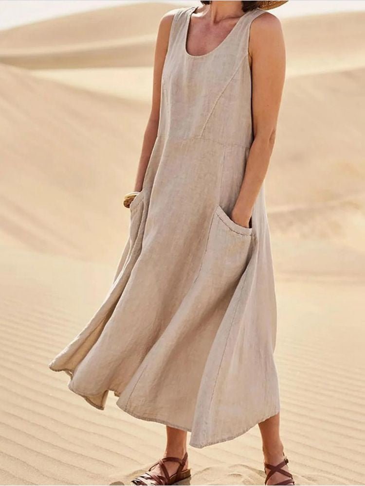 Mujer luciendo vestido de verano casual de algodón. Ideal para la playa, cómodo y transpirable.