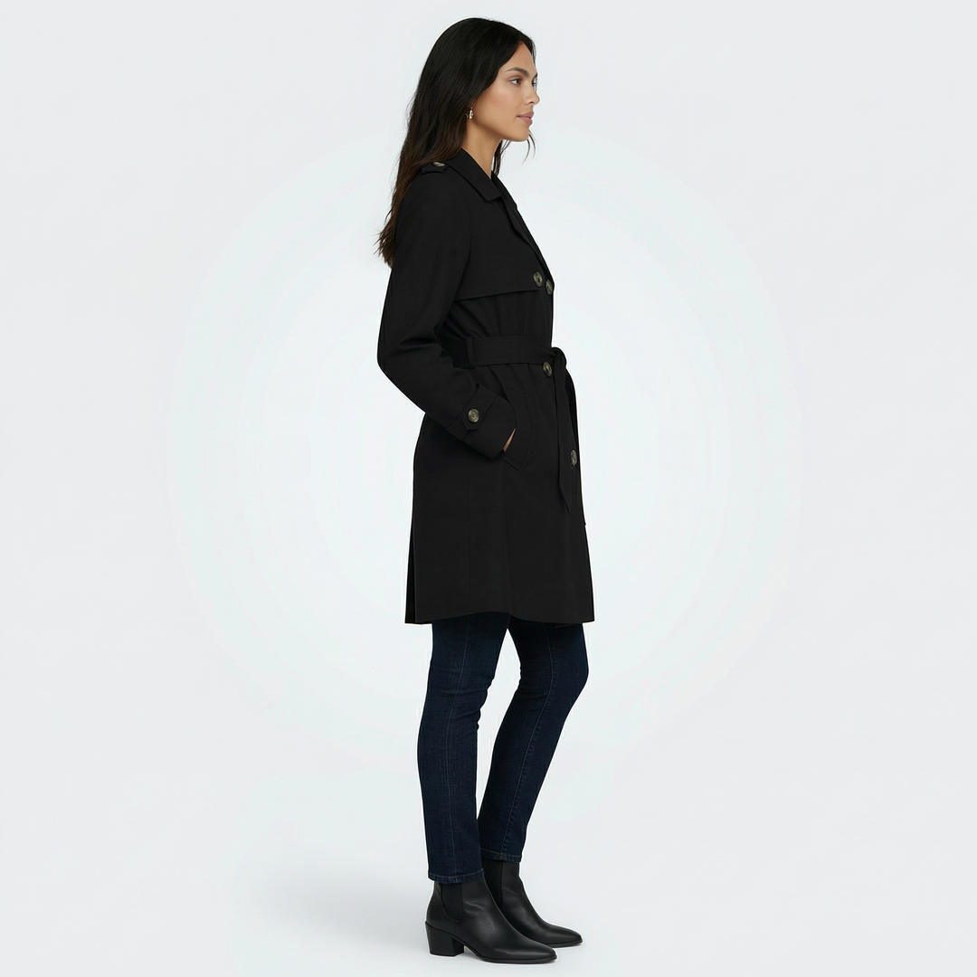 Elegante gabardina midi para mujer, con detalle de doble botonadura. Perfecta para el entretiempo.