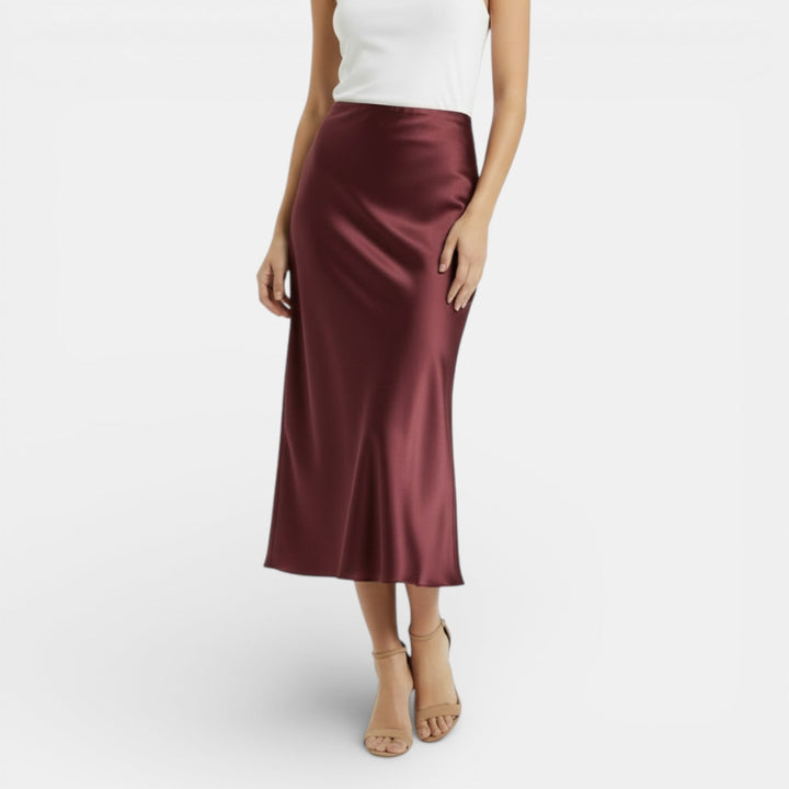 Falda satinada roja vibrante de cintura alta para mujer, outfit de fiesta audaz.