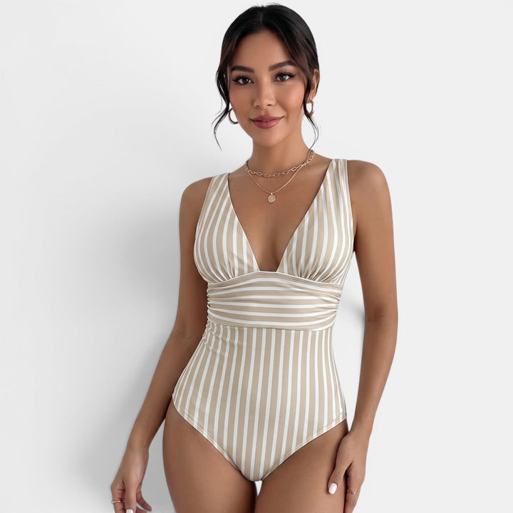 Traje de baño reductor para mujer que estiliza la figura. Diseño elegante con escote V, ideal para la playa.
