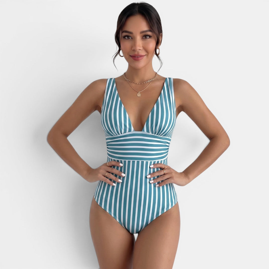 Bañador reductor de mujer negro, escote V que estiliza. Ideal para playa y piscina, elegante para el verano.