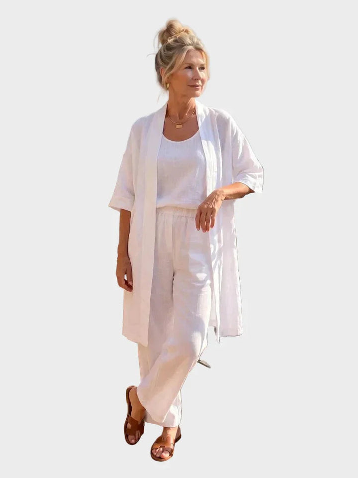 Elegante conjunto de lino mujer. Tres piezas con pantalón ancho y chaqueta larga, ideal para eventos de verano.