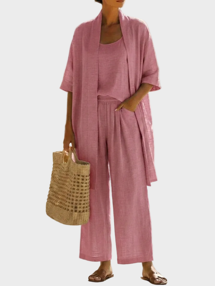 Elegante conjunto de lino de tres piezas para mujer. Ideal para verano, con pantalón ancho y chaqueta larga.