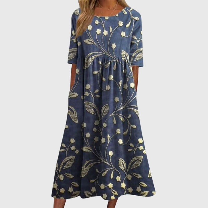 Vestido midi floral de mujer, corte suelto. Ideal para primavera y verano, moda casual y elegante.