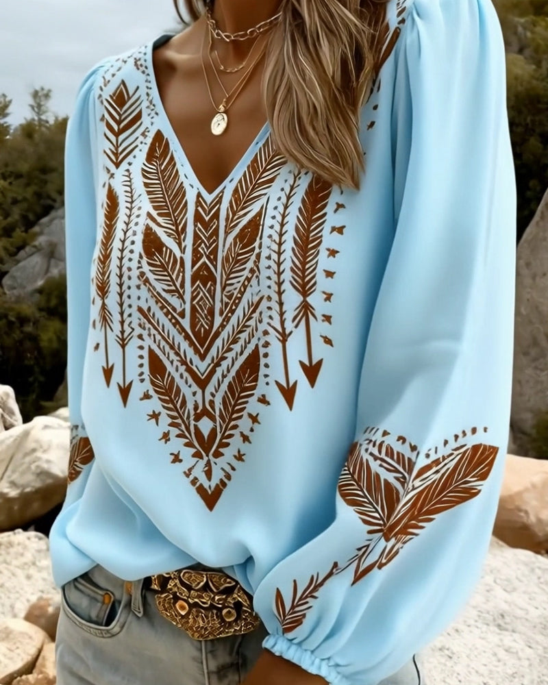 Blusa de mujer estilo boho con estampado étnico y escote profundo en V. Confortable y chic.