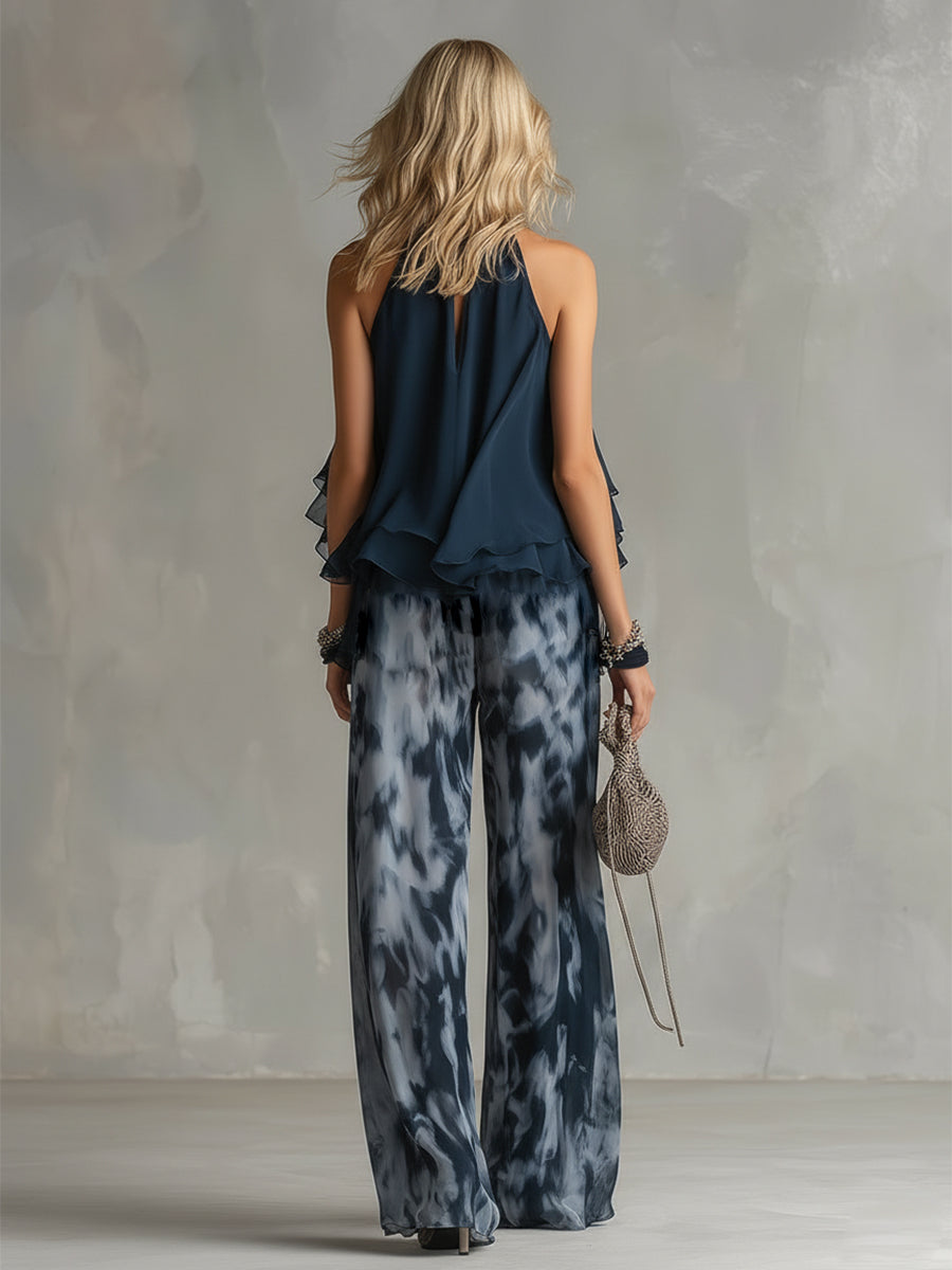 Conjunto de mujer dos piezas: top halter con volantes y pantalón ancho azul marino. Perfecto para celebración.