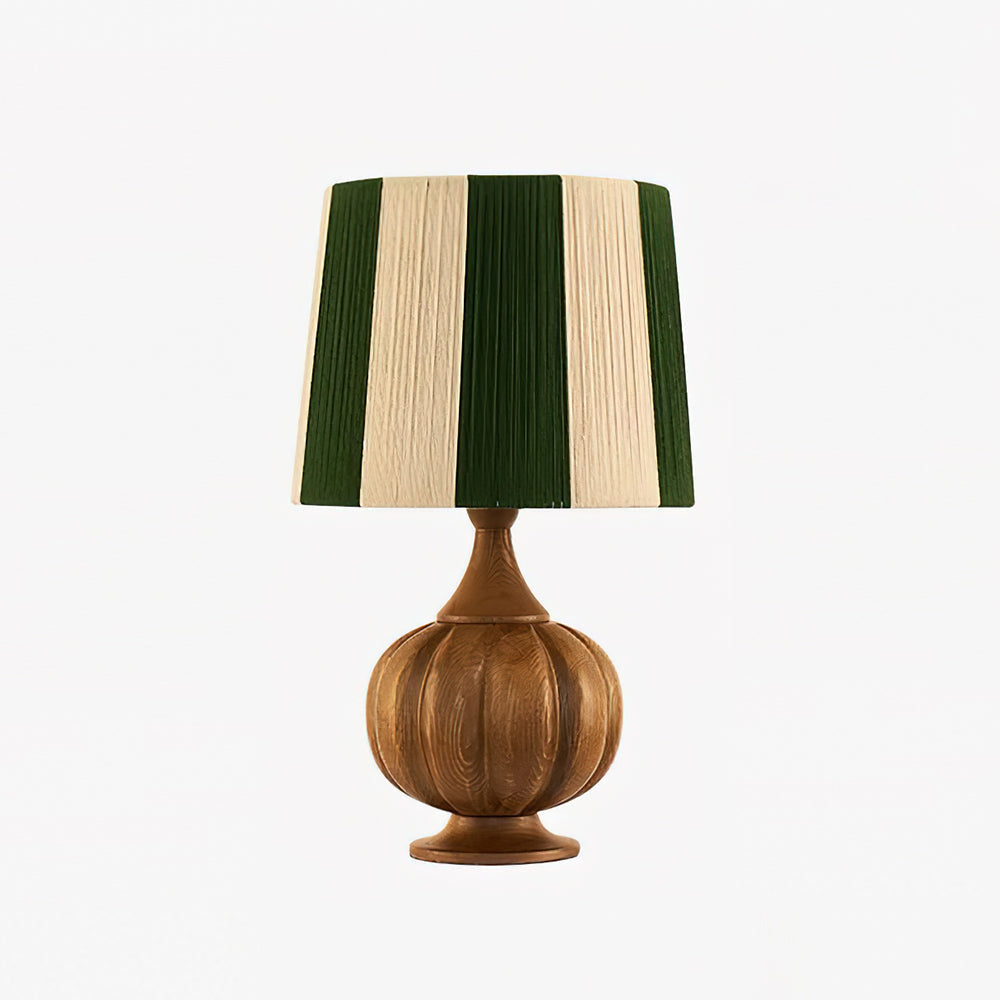 Realza tu decoración con esta lámpara de mesa moderna, con pantalla a rayas y base de madera pulida.