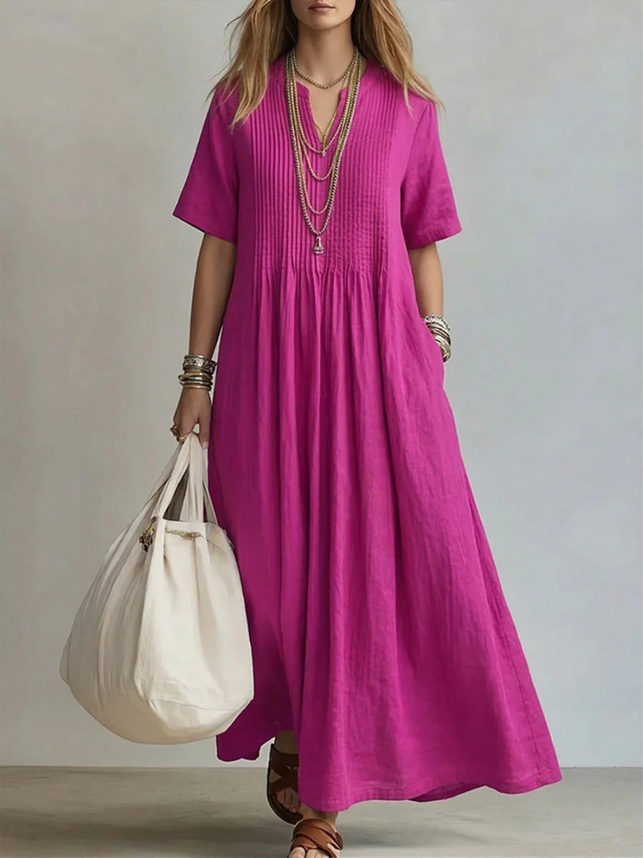 Vestido maxi de algodón fluido para mujer con escote en V, ideal para verano casual y elegante.