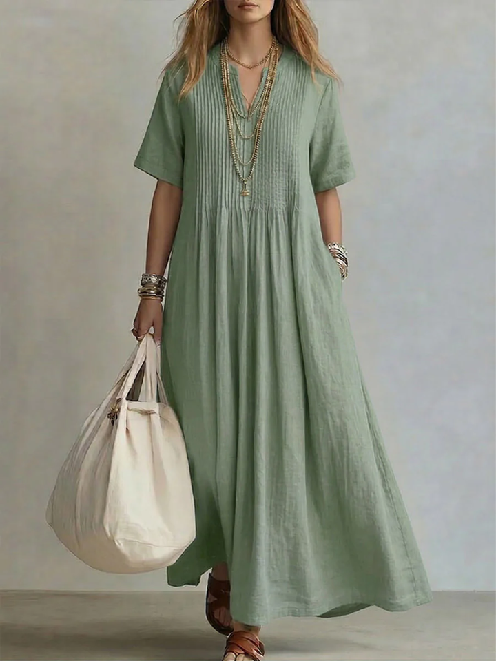 Vestido de mujer de algodón fresco con corte fluido y escote en V, perfecto para tallas grandes.