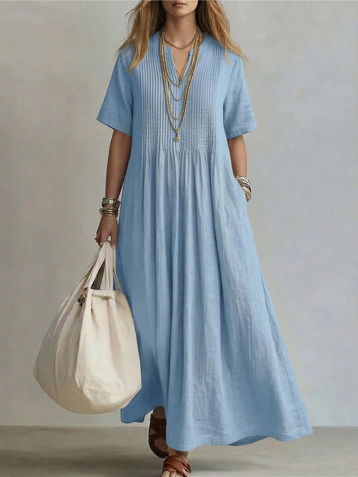 Vestido maxi casual de algodón con escote en V, cómodo y con corte fluido para el verano.
