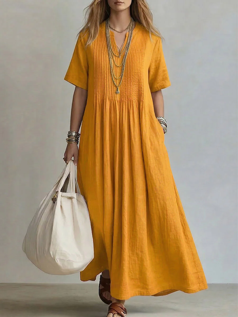 Vestido de algodón para mujer, diseño maxi con escote en V y corte fluido, fresco y versátil.