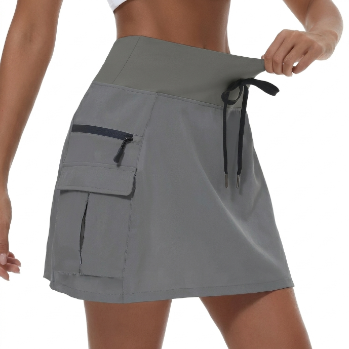 Skort deportivo mujer, falda-short de talle alto para actividades, con prácticos bolsillos.
