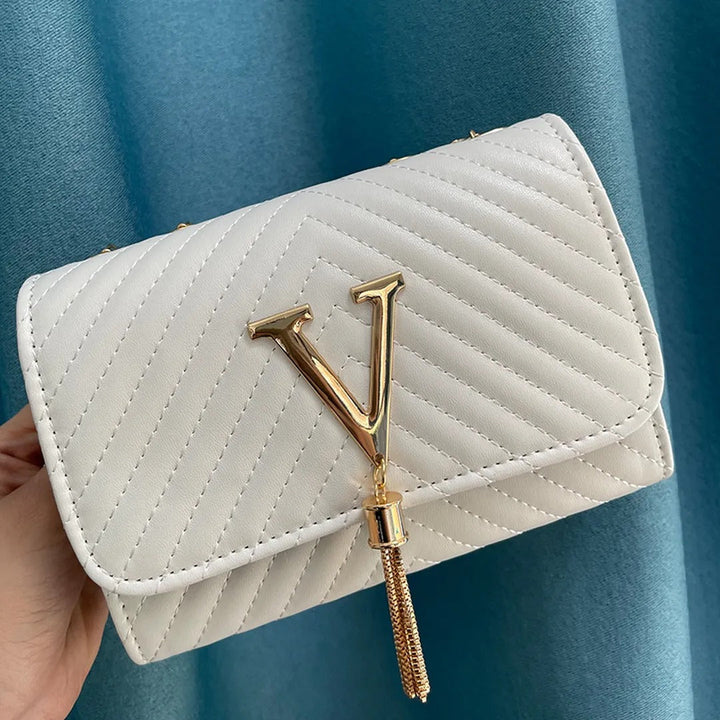 Bolso de mano blanco GLAMIRA para mujer, estilo moderno y elegante con borla, complemento de moda femenina.