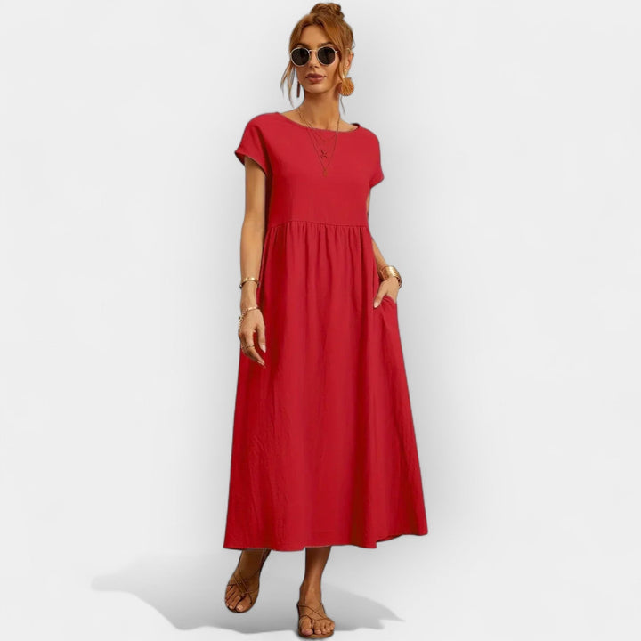 Elegante vestido midi casual de mujer con manga corta y bolsillos discretos, versátil.