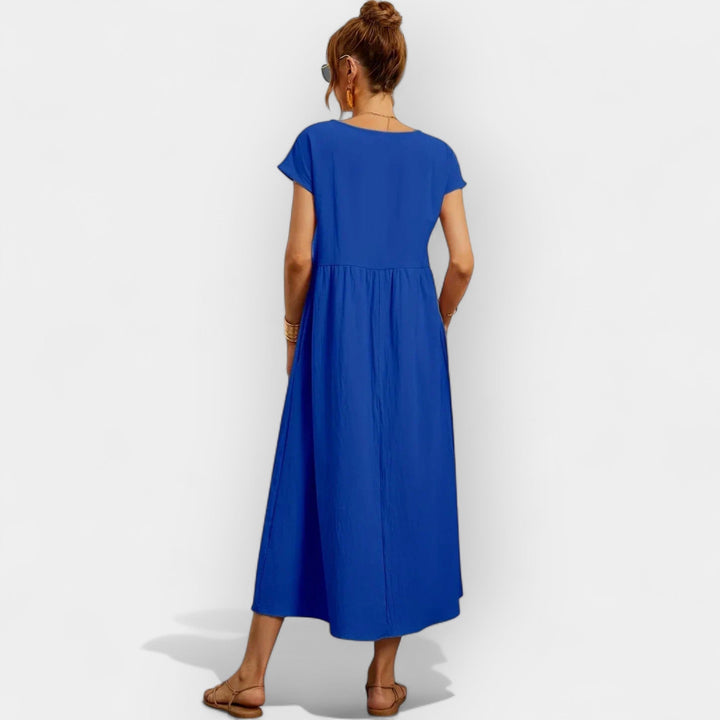 Vestido midi casual versátil para mujer, manga corta, bolsillos, perfecto para primavera/verano.