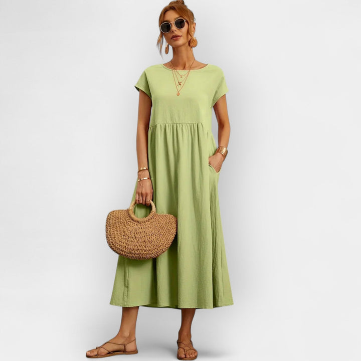 Vestido midi para mujer, diseño casual con bolsillos, manga corta, ideal para ocasiones diarias.