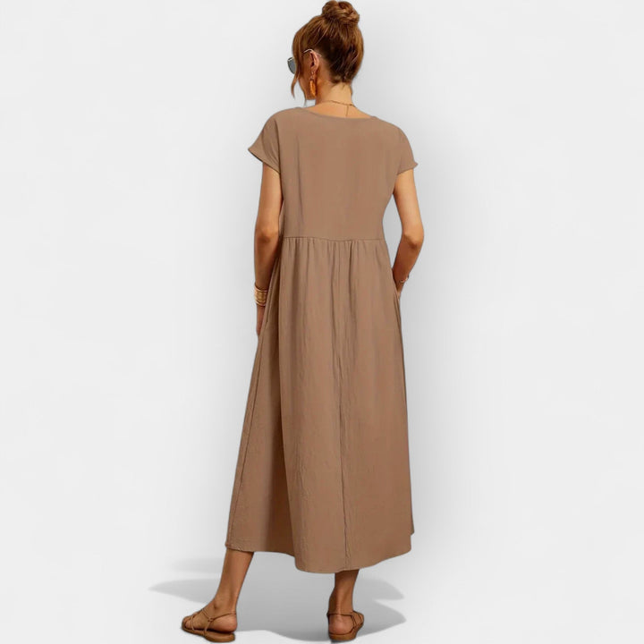 Vestido midi de mujer con bolsillos, manga corta, estilo casual para un look fresco y cómodo.