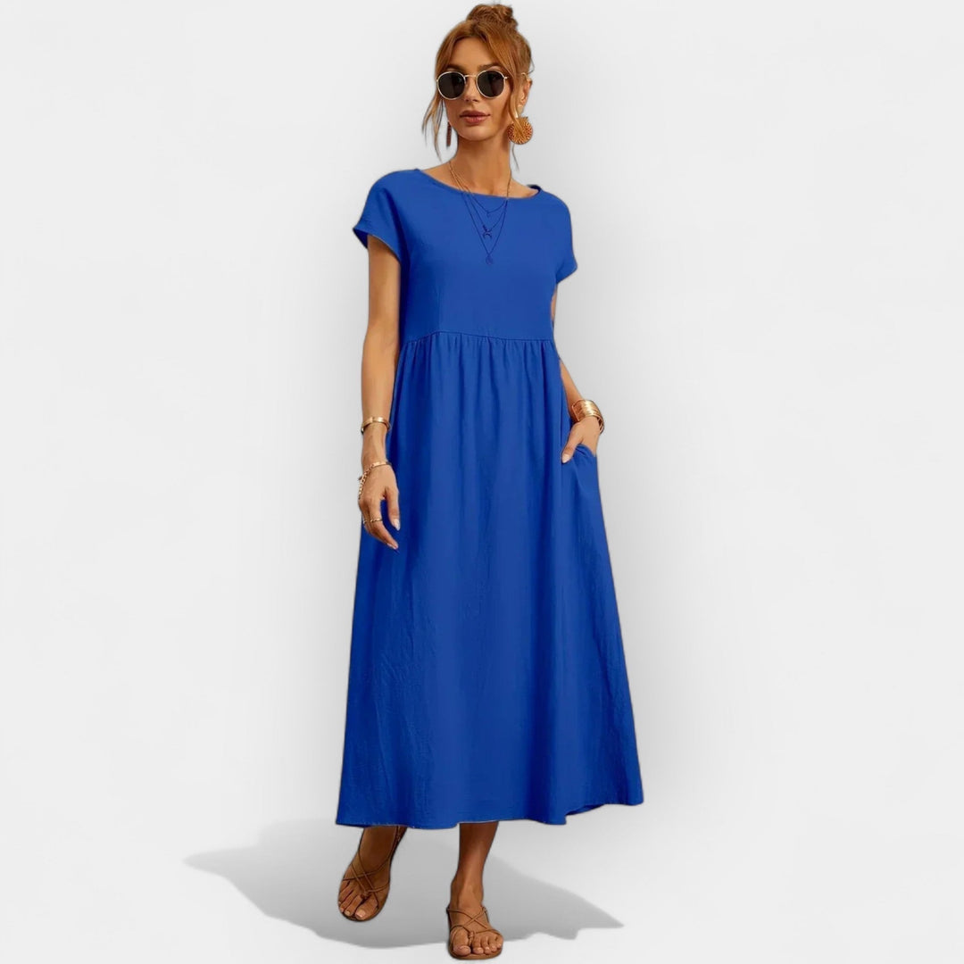 Vestido de algodón midi para mujer, manga corta, estilo casual, con bolsillos prácticos y sencillos.