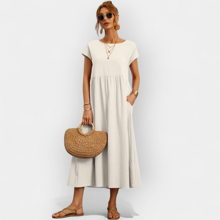 Vestido midi casual para mujer con bolsillos, manga corta, ideal para verano y comodidad.