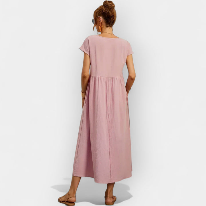 Vestido midi de algodón para mujer, estilo casual, manga corta y bolsillos prácticos.