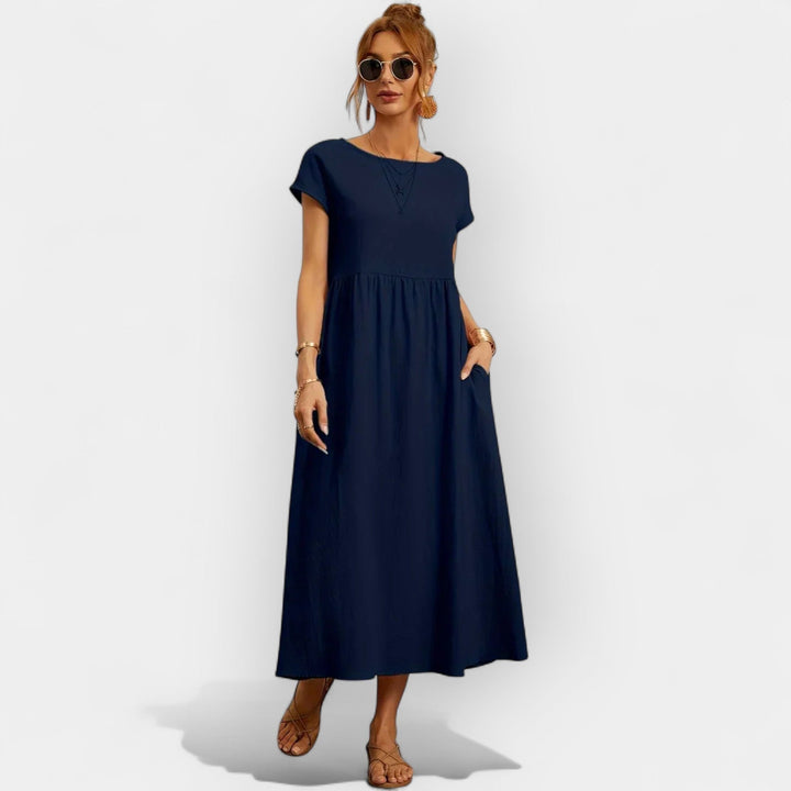 Vestido midi casual de manga corta para mujer, con prácticos bolsillos laterales.